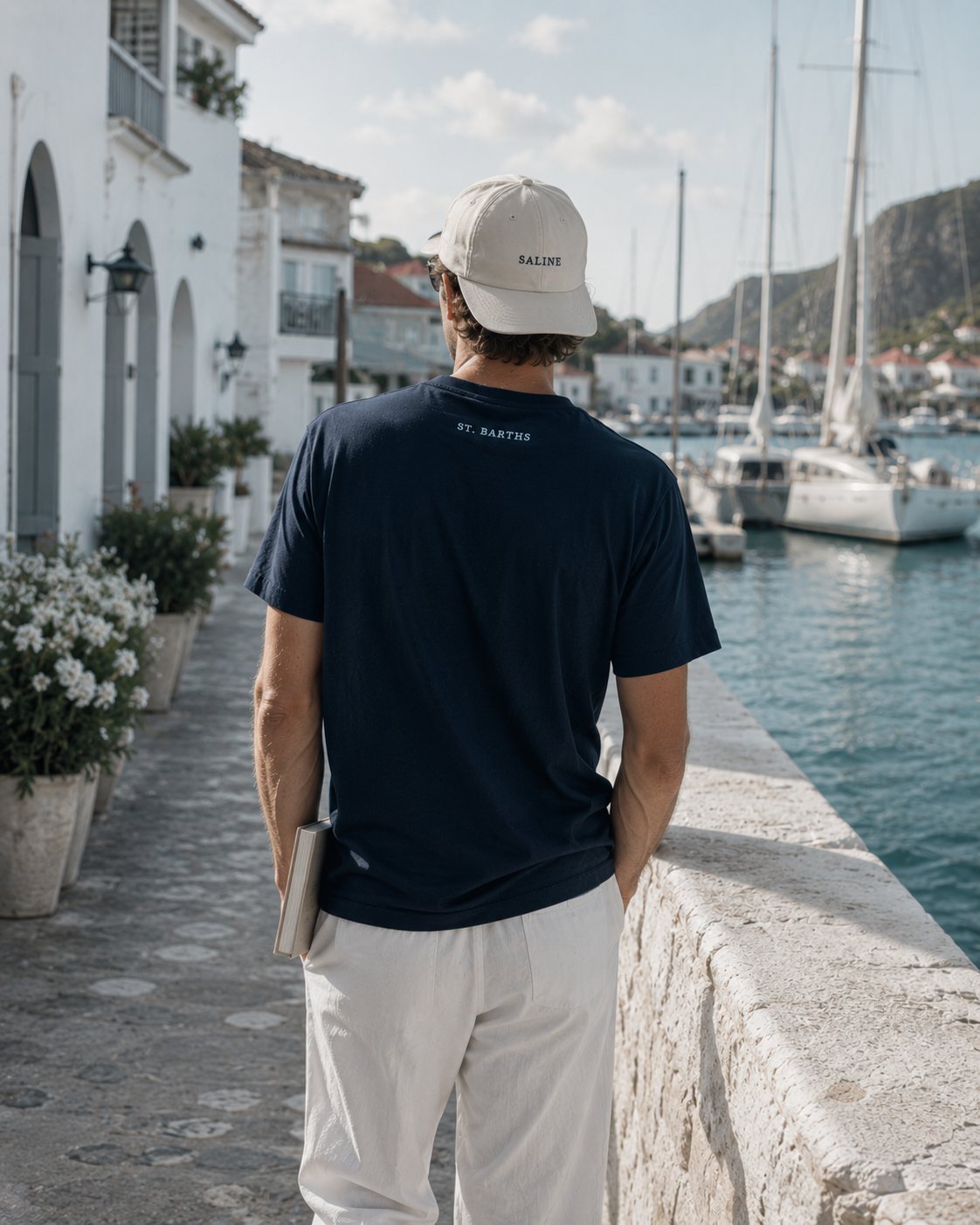 The walk back — figure on the harbor wall